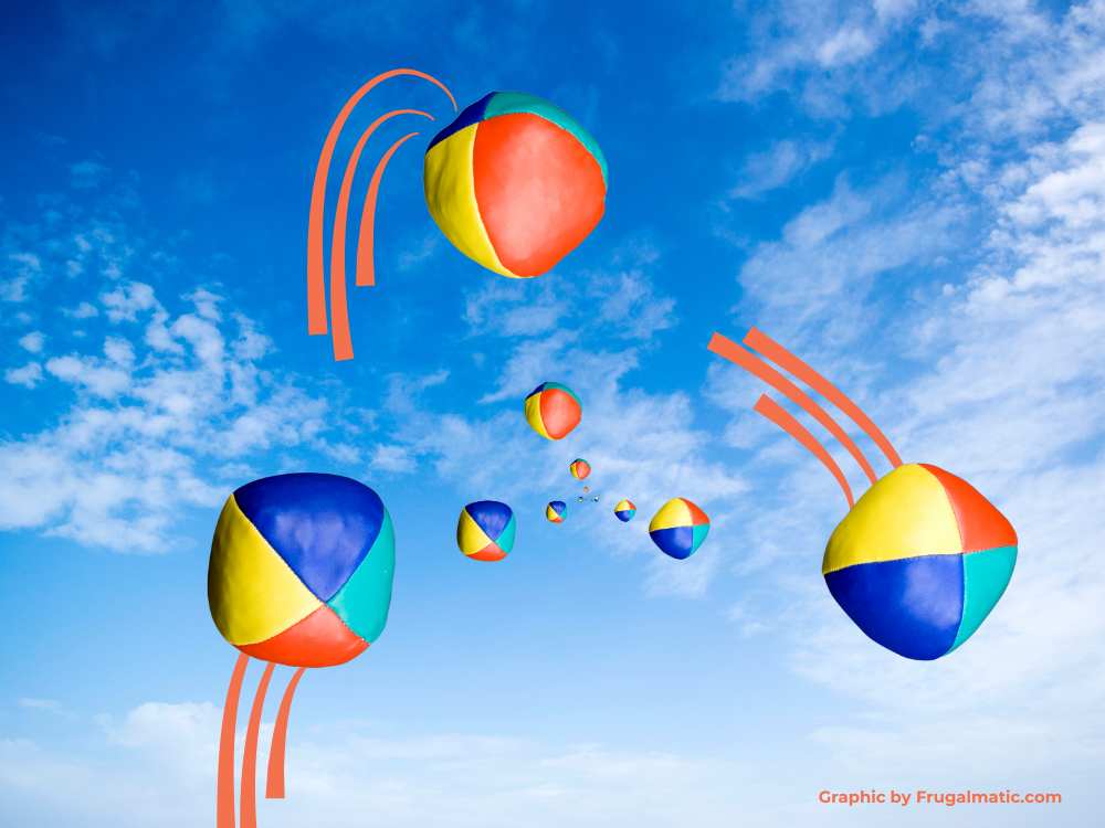 Multiple balls being juggled against sky background.